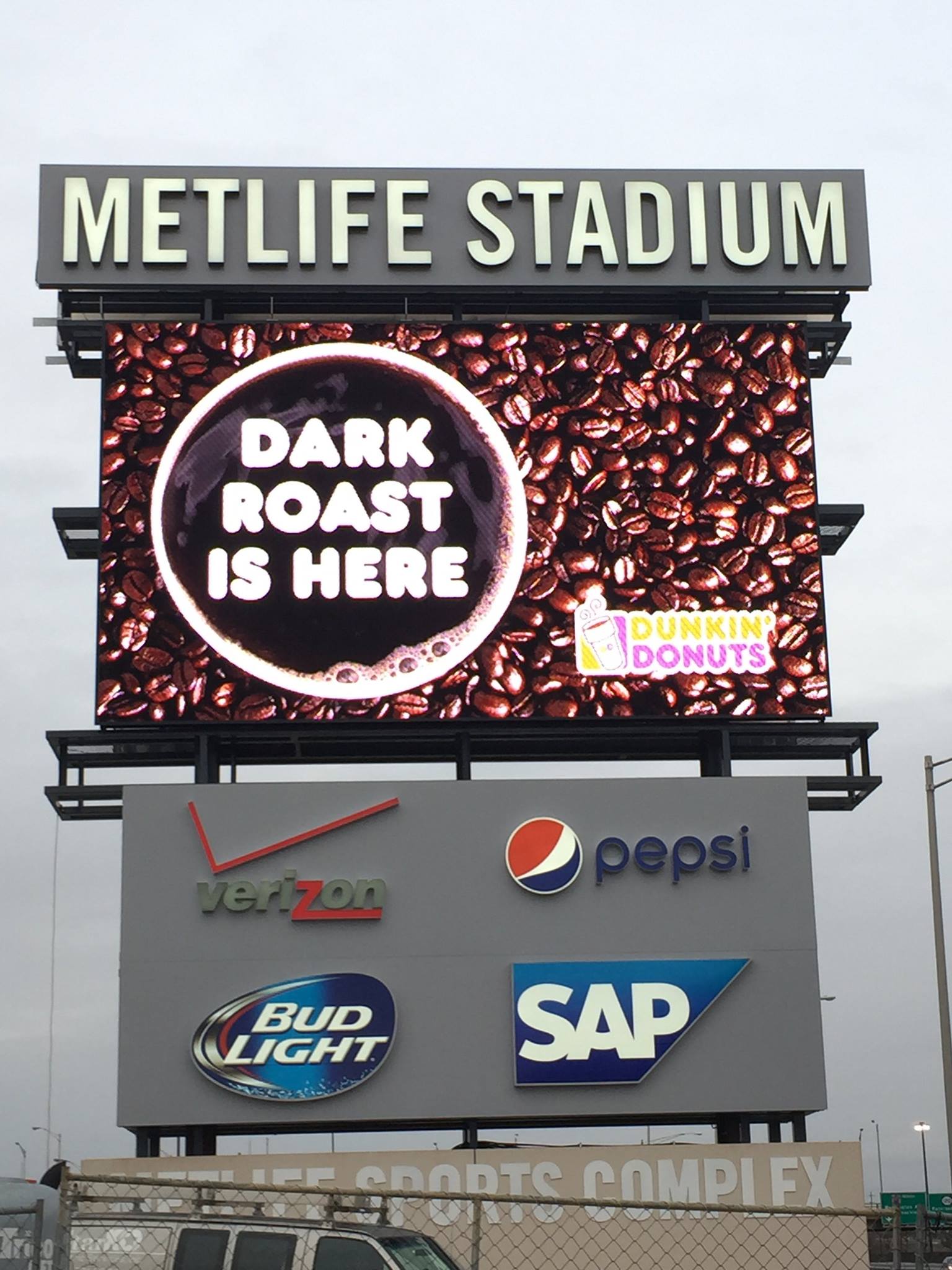 MetLife Stadium Billboard with Dunkin' Donut ad.
