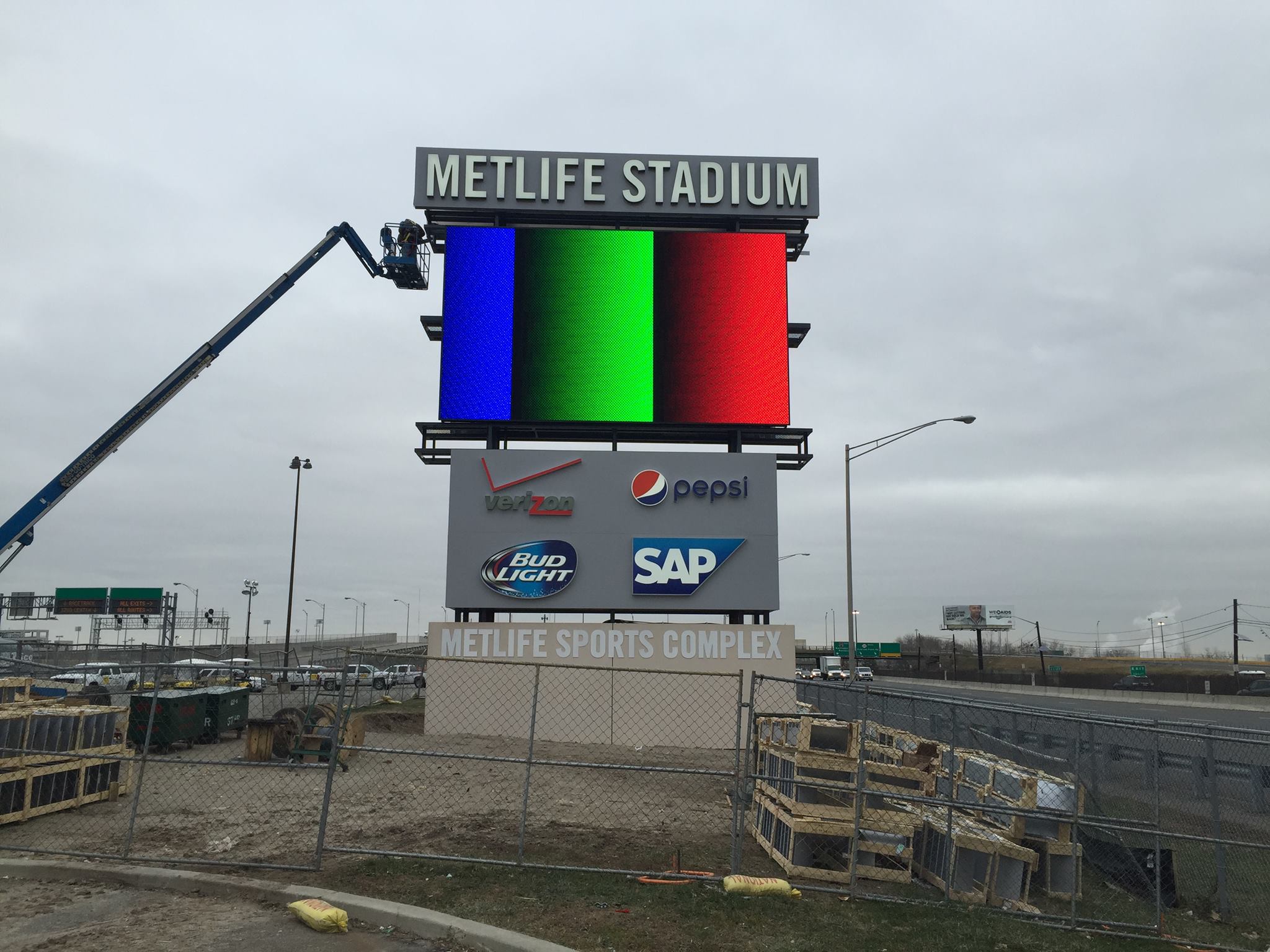 MetLife Stadium sign being installed.